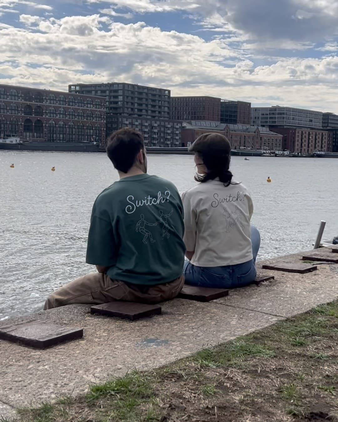 Two friends by the water, Switch? printed on their backs