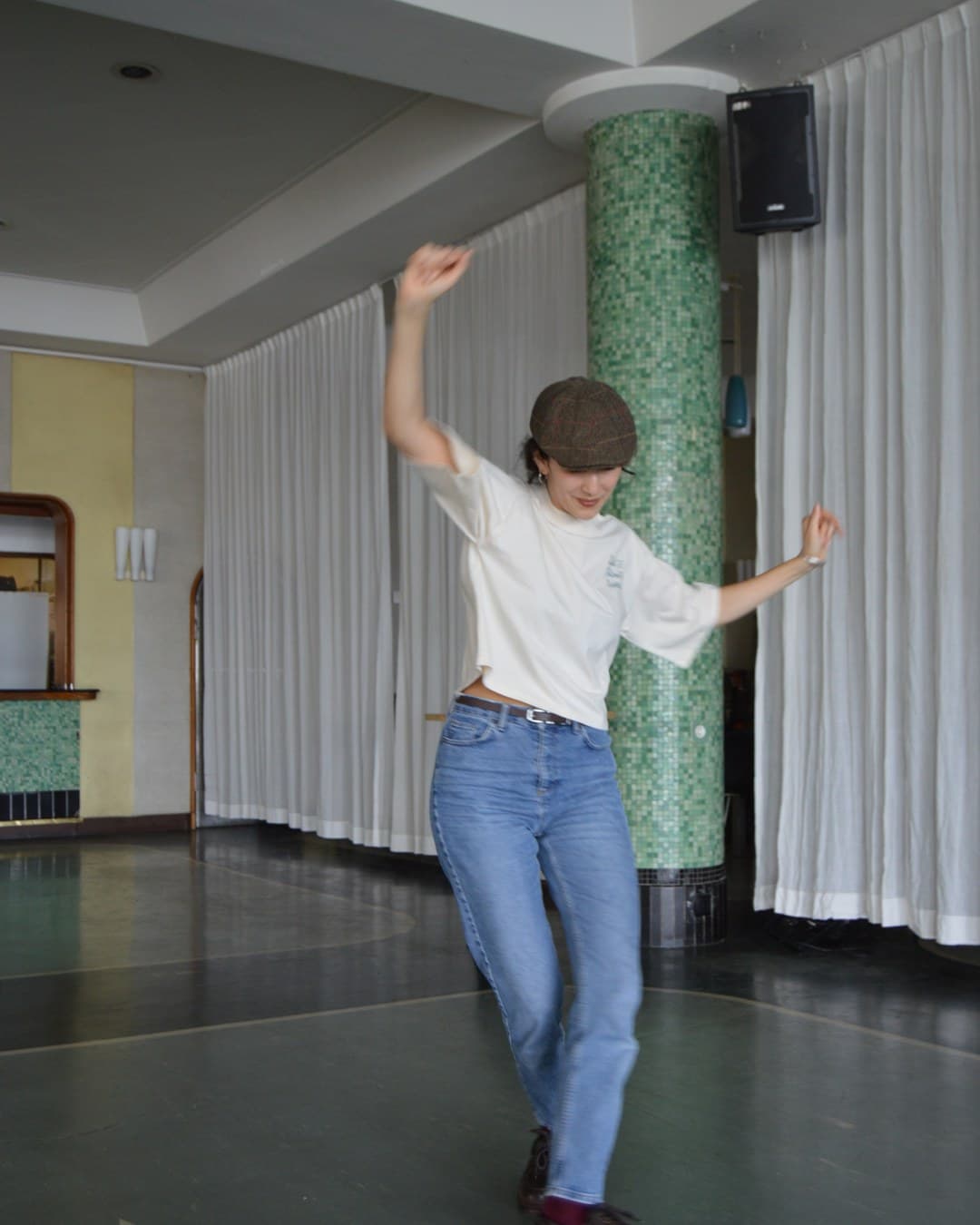 Dancer in the Boxy Crop tee, mid-move on an empty dance floor
